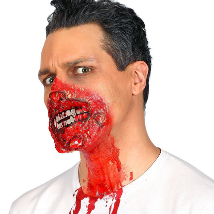 Röhrchen mit Blut und Zähnen