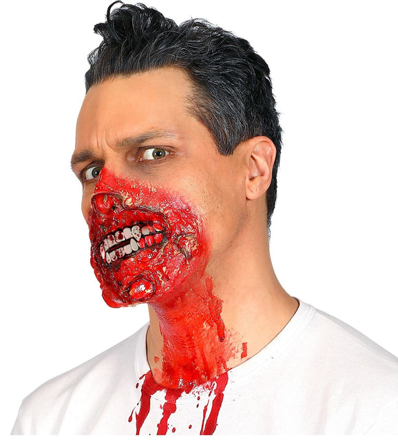 Röhrchen mit Blut und Zähnen